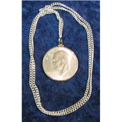 1152. 1976 D Type II Eisenhower Dollar in bezel and suspended