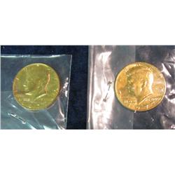 1225. (2) Gold Plated Counter Stamped Kennedy Half Dollars.