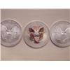 Image 2 : 3 Colorized US .999 Fine Silver Eagles, 2002, 2003, 2005