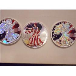 3 Colorized US .999 Fine Silver Eagles, 2002, 2003, 2005