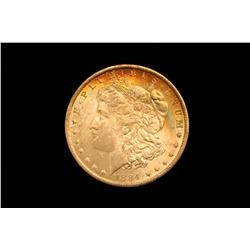 1884-O Morgan Silver Dollar B.U. Rainbow Obverse