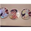 Image 1 : 3 Colorized US .999 Fine Silver Eagles, 2002, 2003, 2005