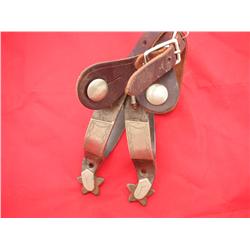 Kelly spurs mounted on one side and etched