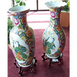 Pair of Hand painted Chinese urns 24'T on teak wood base.Finely hand paintedurns depicting peacocks