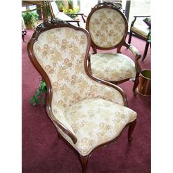 A Pair of Finely upholstered carved mahogany chairs one arm chair w/ carved rose medallions