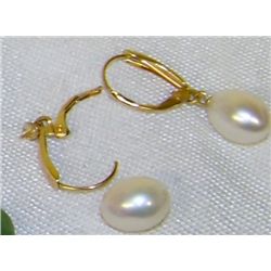 A pair of 14K yellow gold earrings made by Honora w/ 2 oval shaped pearls (one pearl is loose)