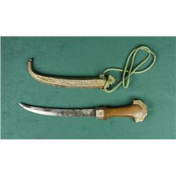 Mid-eastern style curved blade knife with  wood grip, hammered brass pommel and nicely  accomplished