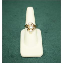 3-Pearl and Diamond Ring set in 14kt yellow  gold. Est. $100-$200