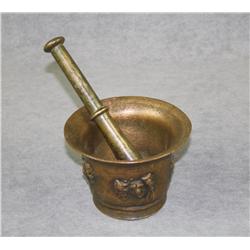 Old cast brass mortar and pestle approx.  3-1/2” in diameter and approx. 3-1/2” in  height with a da