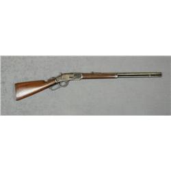 Winchester Model 1873 lever action rifle, .38  cal., 24” round barrel, blue finish, wood  stocks, sh