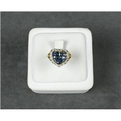 One 14lt yellow gold ladies ring with  invisible set princess cut blue sapphire and  diamonds. Est. 