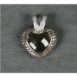 One heart shaped pendant made in 14kt white  gold and set with a heart shaped checkered  cut smokey 