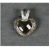 Image 1 : One heart shaped pendant made in 14kt white  gold and set with a heart shaped checkered  cut smokey 