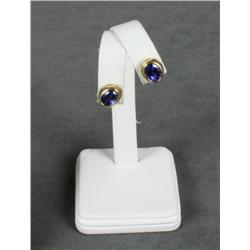 14kt yellow gold earrings set with oval  tanzanites (aprox 4ct total). Est.  $2,000-$4,000.