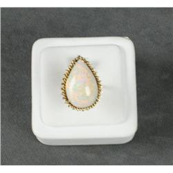 14kt yellow gold ladies ring set with a fine  pear shaped white crystal opal. Est.  $2,500-$5,000.