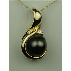Exquisite 14 karat heavy yellow gold ladies  custom made ladies pendant fine set with a  round cultu