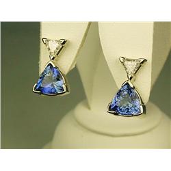 Dazzling 14 karat white gold ladies custom  made earrings set with two matching trilliant  cut Tanza