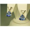 Image 1 : Dazzling 14 karat white gold ladies custom  made earrings set with two matching trilliant  cut Tanza