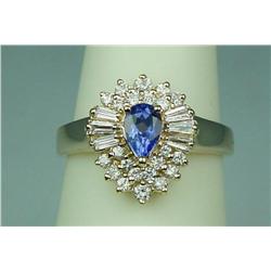 Gorgeous 14 karat yellow gold ladies  ballerina design ring fine set with a center  pear shape Tanza