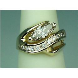Gorgeous 14 karat yellow gold ladies  contemporary design ring set fine set with a  center MQ cut di