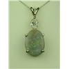 Image 1 : Fabulous 14 karat white gold ladies custom  made pendant set with a large Black  Australian Opal wei