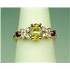 Image 1 : Charming 14 karat yellow gold ladies ring set  with an oval yellow sapphire weighing  approx. 1.00 c