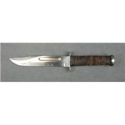 USMC marked KA-BAR military knife in fair  condition with good blade and worn leather  grip.  Est.: 