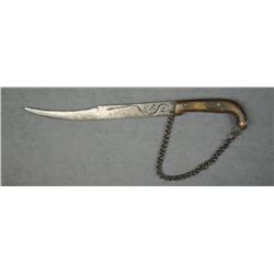 Small thin curved blade Mexican knife approx.  11” overall with an approx. 7” blade that  shows a gr