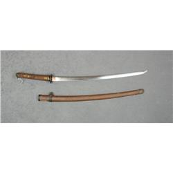 Japanese Samauri sword and scabbard with what  appears to be a machine made blade that is  in overal