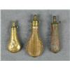Image 1 : Lot of three brass powder flasks including a  large embossed bag flask in very good  condition, a me