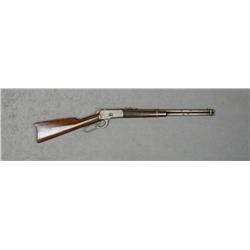 Winchester Model 1892 SRC, .38 WCF cal., 20”  barrel, blue finish, wood stocks, #296951.  This gun i