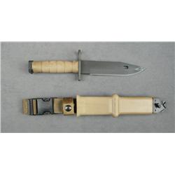 U.S. military M10 bayonet by Ontario Knife  Co. with tan composite sheath and tan woven  hanger in l