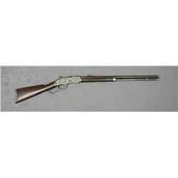 Winchester Model 1873 lever action rifle, .38  WCF cal., 24” octagon barrel, blue finish,  wood stoc