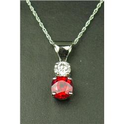 High quality 14 karat white gold ladies  custom made pendant set with a center extra  fine red Ruby 