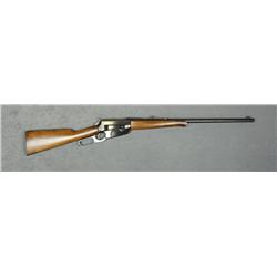 Browning Model 1895 lever action rifle,  .30-40 cal., 24” round barrel, blue finish,  wood stocks, #