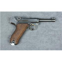 German Luger semi-auto pistol, 9mm cal., 4”  barrel, military mat finish, checkered wood  grips, #85