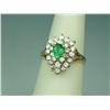 Image 2 : Gorgeous 14 karat yellow gold ladies ring  made by “SPARK’ creations set with a center  fine green E