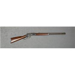 Winchester Model 1873 lever action rifle, .38  WCF cal., 24” round barrel, blue finish,  wood stocks