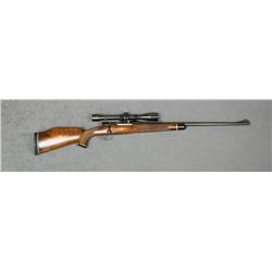 Sporterized  Mauser bolt-action rifle, 7mm  cal., 24” round barrel, blue finish, deluxe  checkered a