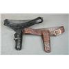 Lot of two Western style leather holsters and  cartridge belts and a brown commercial  hardcase for 