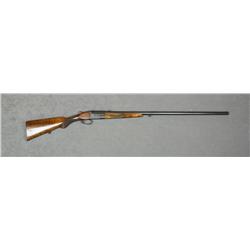 Single Shot shotgun, 16 gauge, 33” barrel,  re-blued finish, light engraving on the  receiver, check