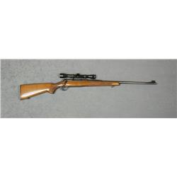 Winchester Model 70 bolt-action rifle, .270  WCF cal., 24” round barrel, blue finish,  checkered woo