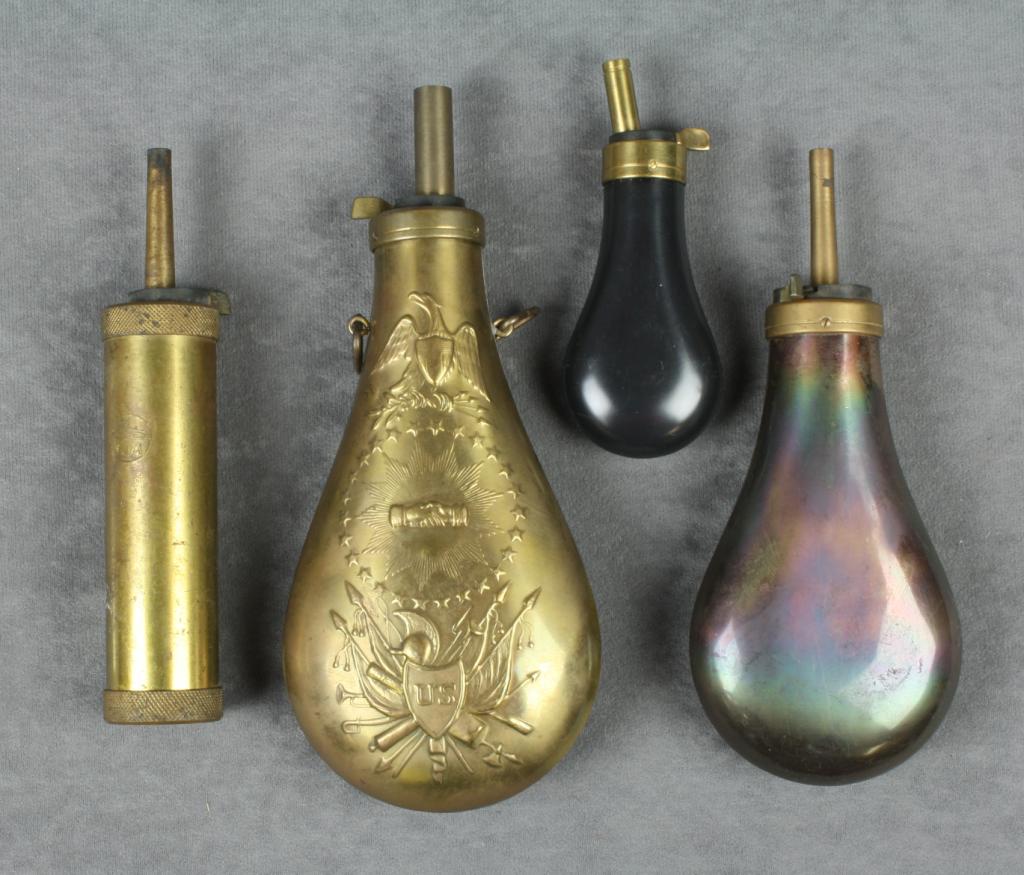 Lot of three reproduction brass powder flasks including two embossed