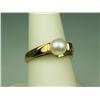 Image 1 : Pleasant 10 karat yellow gold ladies freeform  design ring set with a center round Pearl  averaging 
