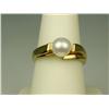 Image 2 : Pleasant 10 karat yellow gold ladies freeform  design ring set with a center round Pearl  averaging 