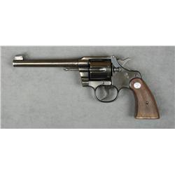 Colt Officer’s Model DA revolver, .38 cal.,  6” barrel, blue finish, checkered medallion  wood grips