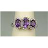 Image 1 : Dazzling 10 karat white gold ladies designer  ring set with three matching oval Amethyst  weighing a