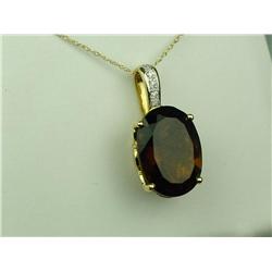 Stunning 14 karat yellow gold ladies custom  made pendant set with a large oval smoky  Topaz weighin