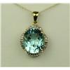 Image 1 : Dazzling 10 karat yellow gold pendant set  with a center oval sky blue Topaz weighing  approx. 6.00 