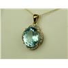 Image 2 : Dazzling 10 karat yellow gold pendant set  with a center oval sky blue Topaz weighing  approx. 6.00 